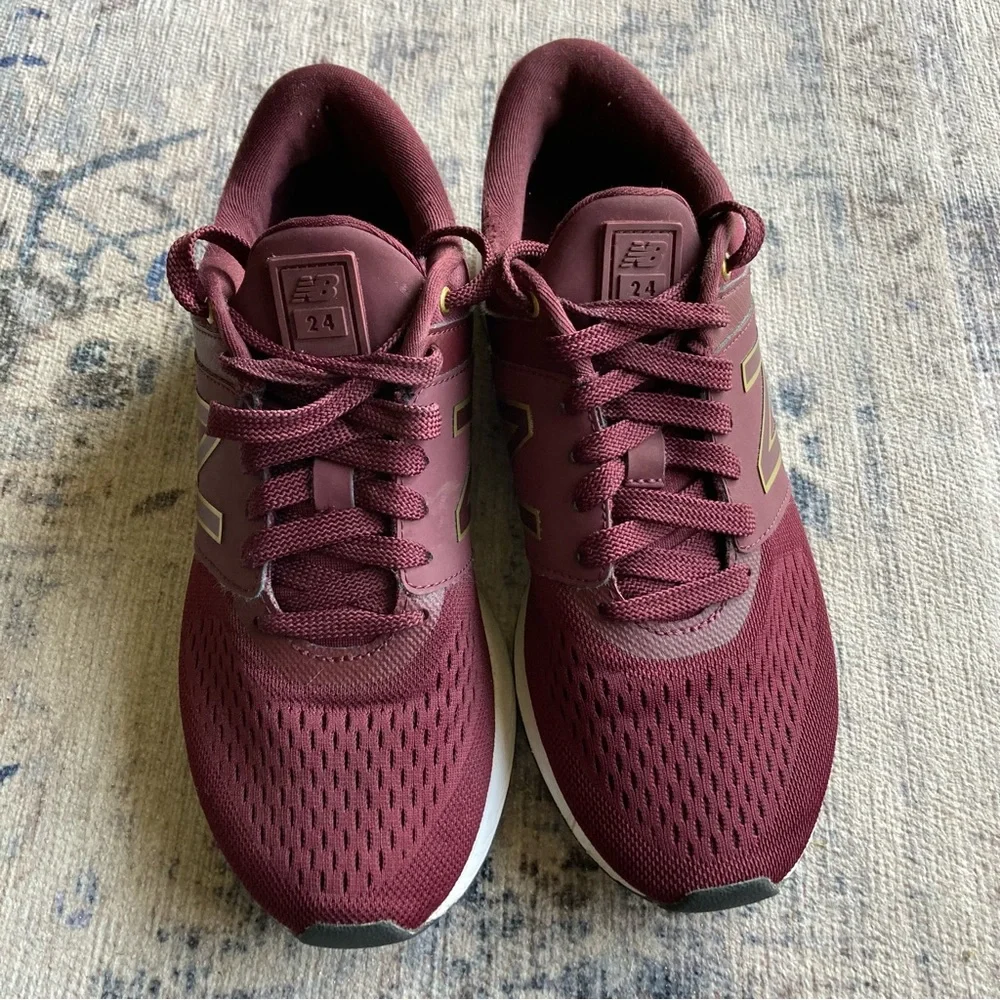 New Balance women’s Burgundy Sneakers with Gold Accent